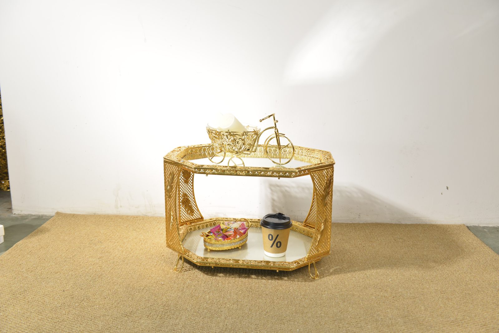 Gold metal coffee table with marble top in modern living room setting